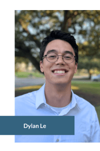 Person smiling outdoors with trees in the background.