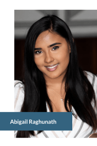 Portrait of a person with long, dark hair, wearing a striped top and cross necklace.